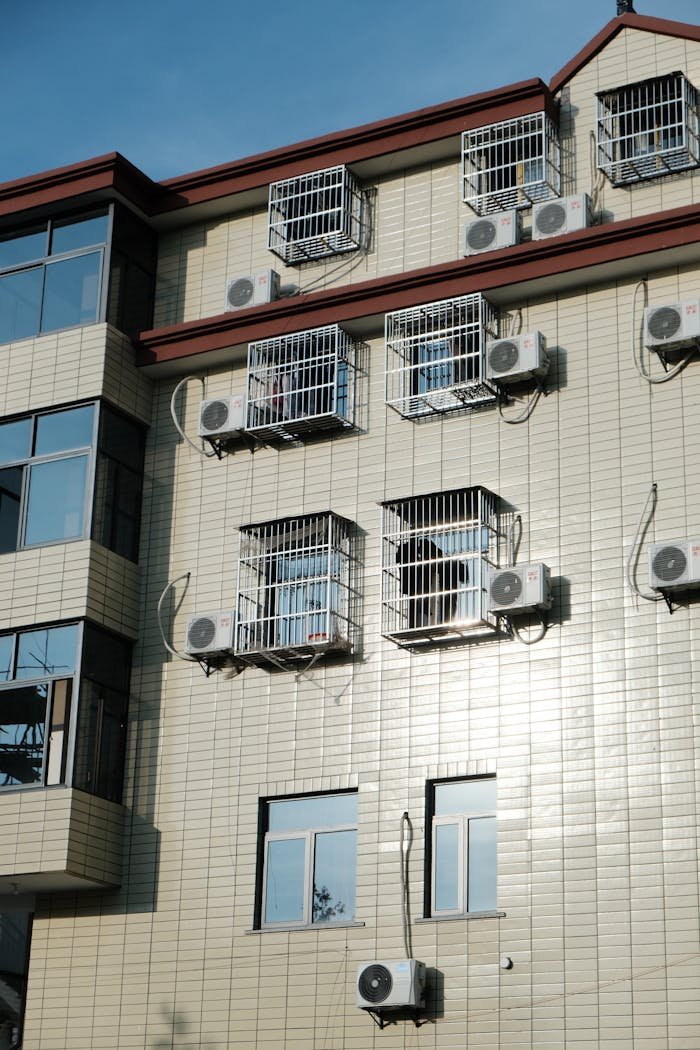 Modern building facade with multiple air conditioners